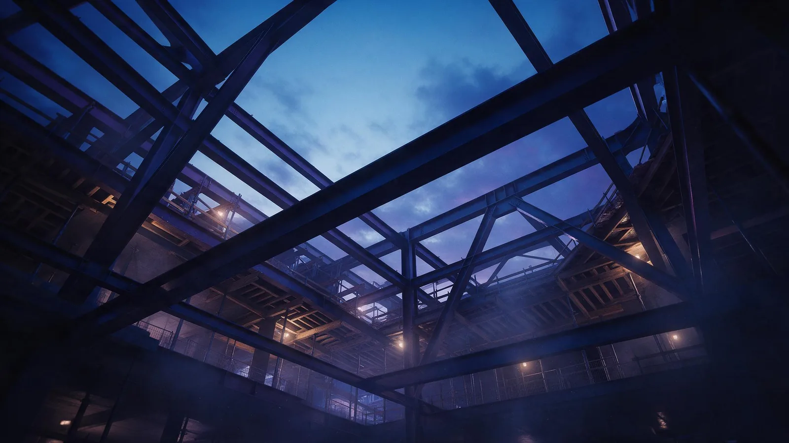 Structural steel and glass of a high-rise under construction, seen from below.